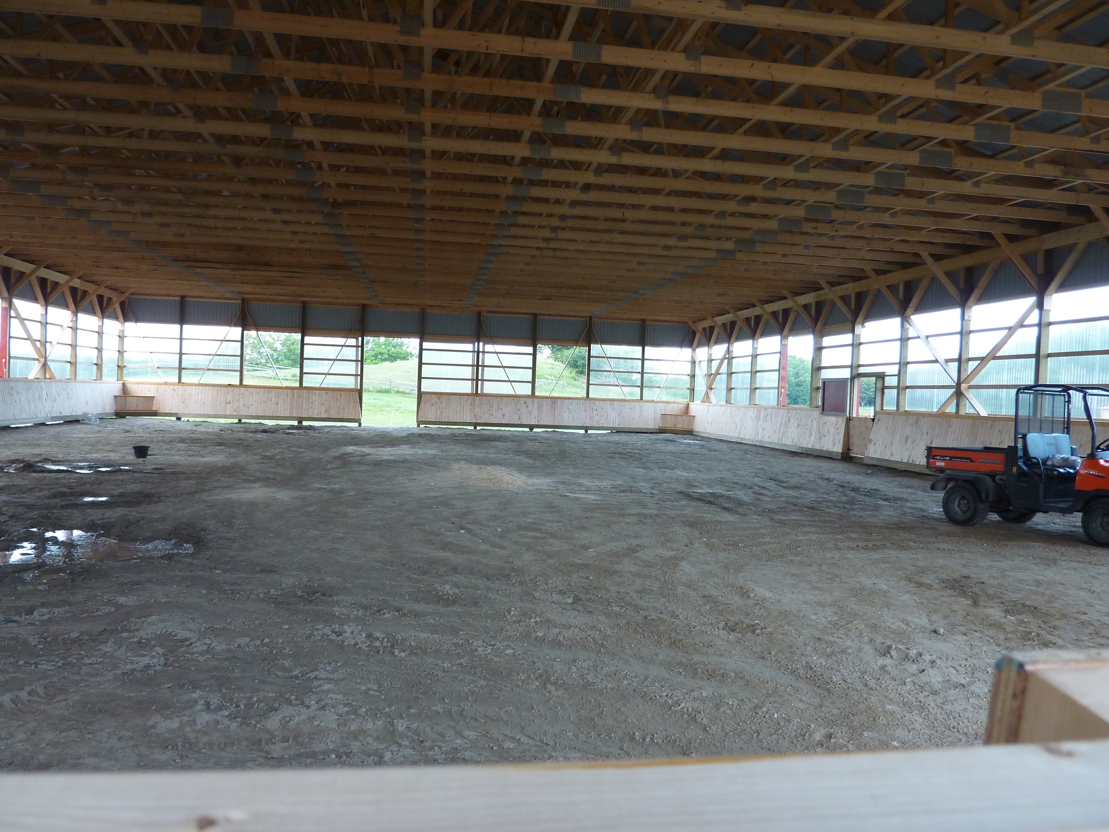 Once inside, the enormity of the arena's dimensions (80 x 120) becomes more apparent. It's important to note, ceiling lights and the final layers of footing have not yet been installed.